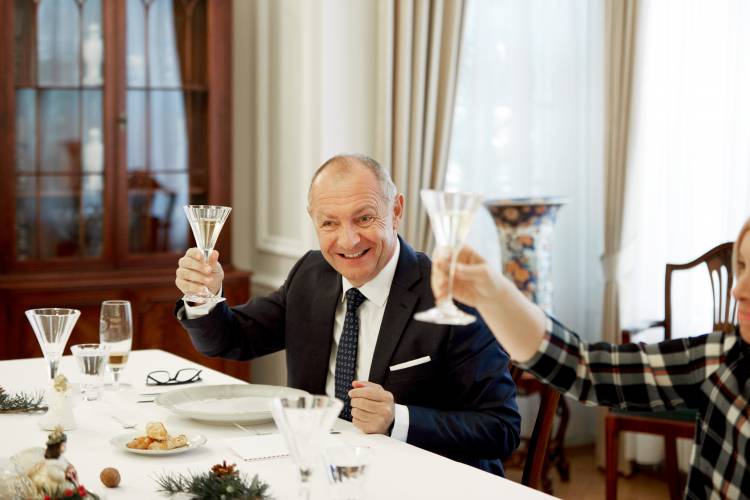 Ambassador Libor Secka raises a glass to toast the season